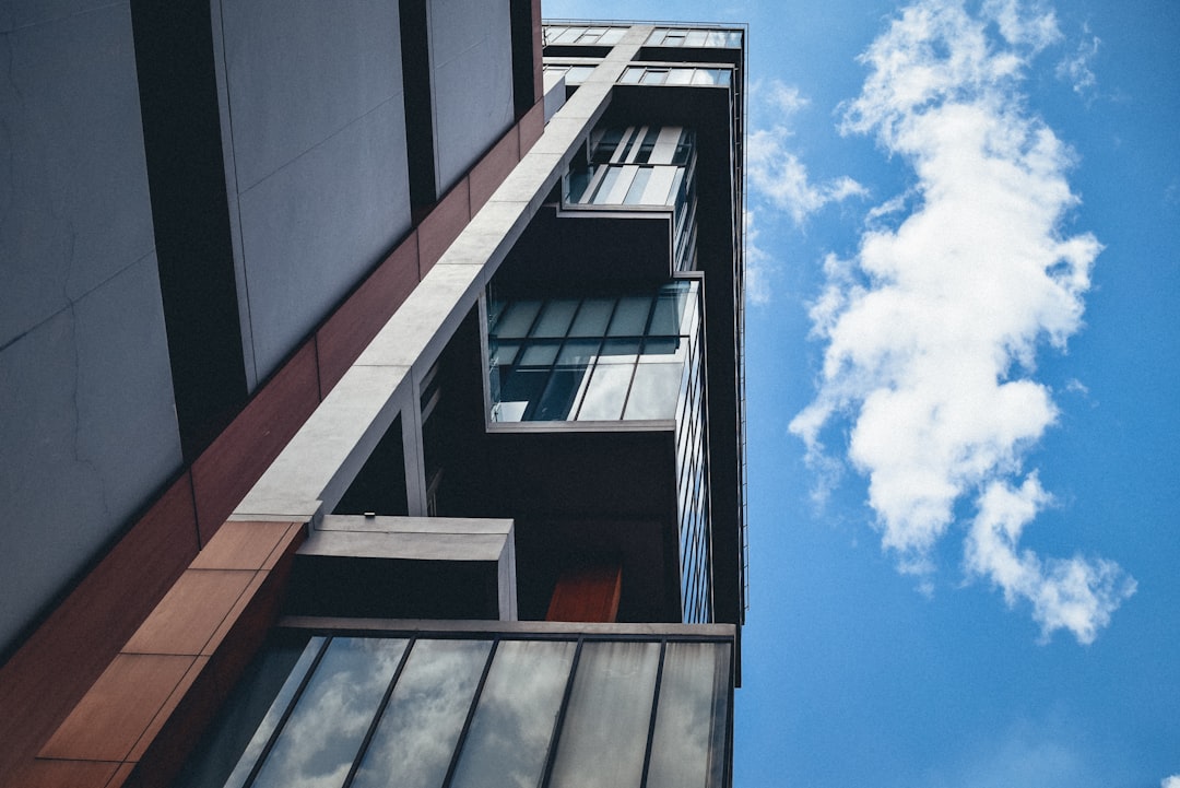 team-01 a-tall-building-with-windows-and-a-sky-background-r3am5rk0ps4