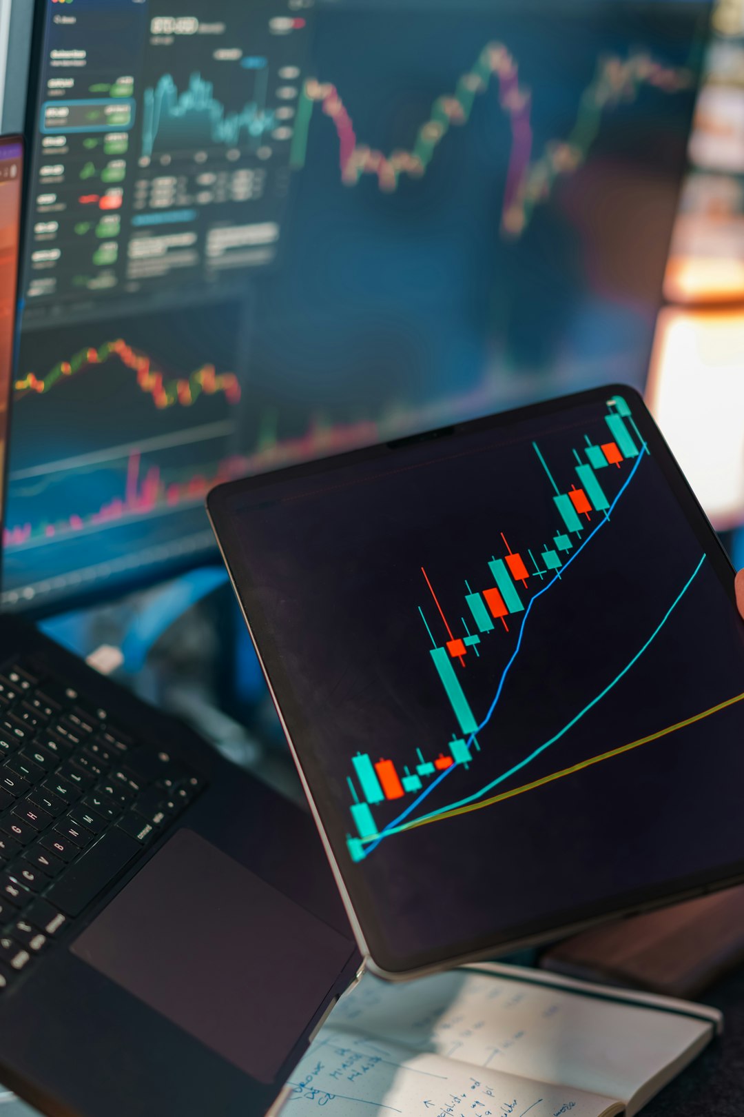 The Art of Drawing Readers In: Your attractive post title goes here Financial trading analytics candlestick chart laptop tablet. Digital market analysis workspace showing price movement graphs technical indicators data visualization screens investment finance concept editorial business technology